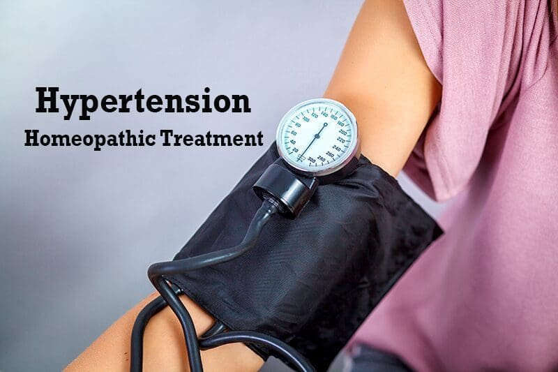 A variety of homeopathic remedies next to a blood pressure monitor, representing natural treatment options for hypertension.